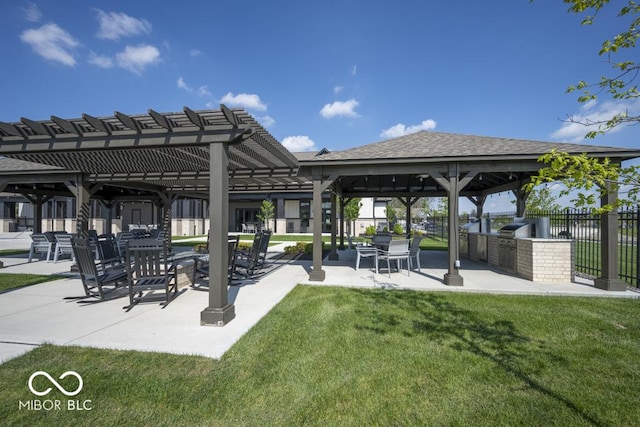 view of home's community with an outdoor kitchen, a gazebo, and a patio