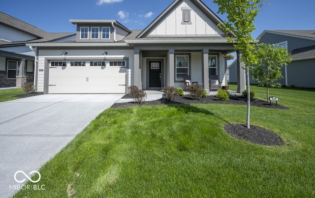view of front of home featuring board and batten siding, driveway, an attached garage, a front lawn, and a porch