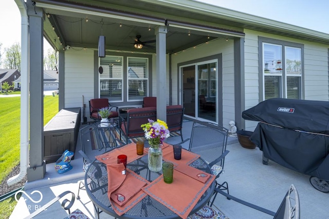 view of patio / terrace featuring outdoor dining area, a ceiling fan, and a grill