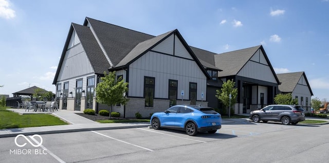 view of building exterior featuring uncovered parking