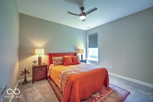 bedroom with carpet flooring, baseboards, and a ceiling fan