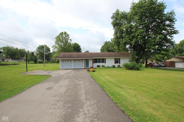 2237 W 100 N, Greenfield, IN 46140 - ranch-style home featuring asphalt driveway, a garage, and a front lawn