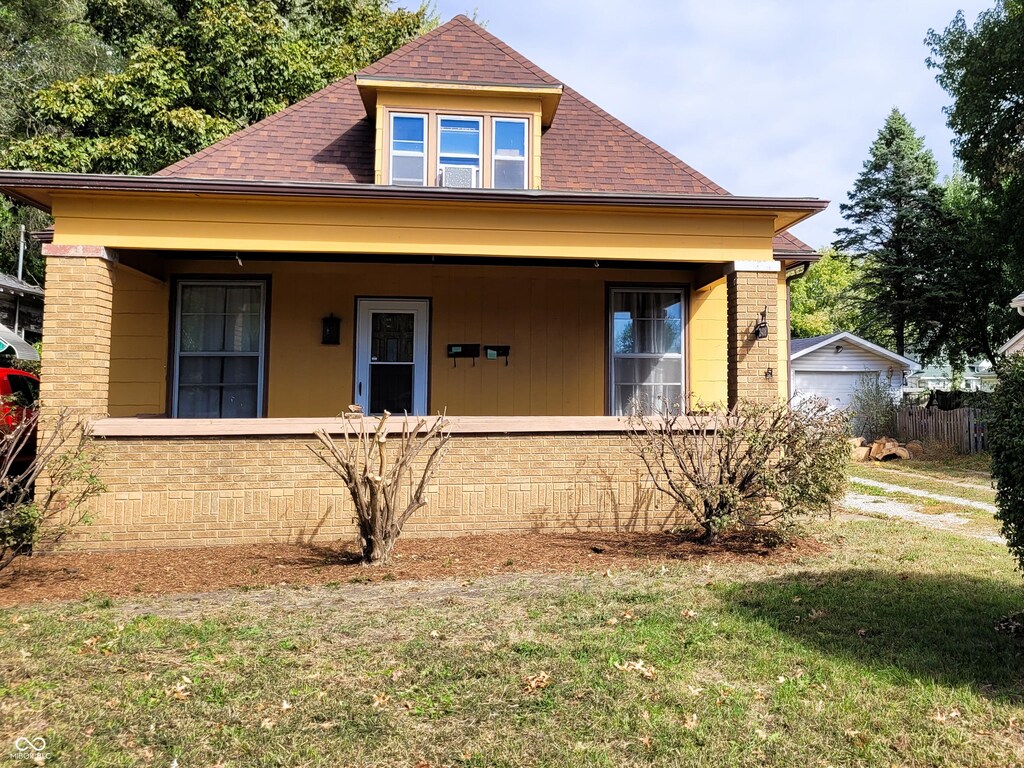 2408 Washington Ave, Terre Haute, IN 47803 - bungalow-style house featuring brick siding, roof with shingles, and covered porch