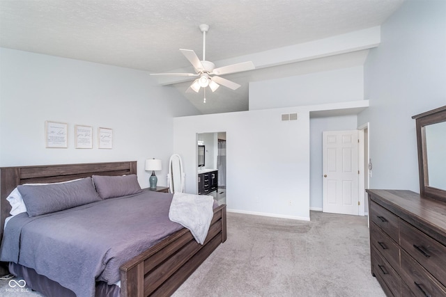 bedroom featuring light colored carpet, baseboards, high vaulted ceiling, a ceiling fan, and connected bathroom