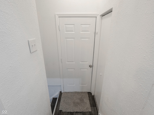 doorway featuring a textured wall