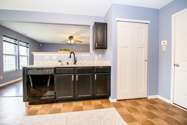 1404 Norton Dr, Greenwood, IN 46143 - kitchen featuring black dishwasher, a sink, baseboards, a ceiling fan, and a peninsula