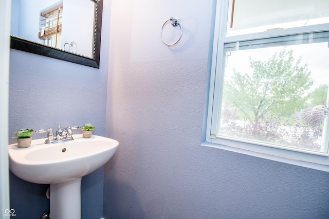 1404 Norton Dr, Greenwood, IN 46143 - bathroom featuring a textured wall and a sink