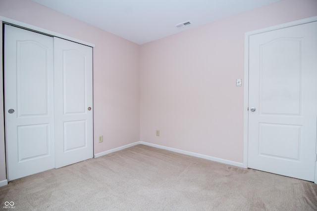 1404 Norton Dr, Greenwood, IN 46143 - unfurnished bedroom featuring carpet flooring, baseboards, and a closet