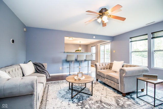 1404 Norton Dr, Greenwood, IN 46143 - living area featuring wood finished floors, ceiling fan, and baseboards