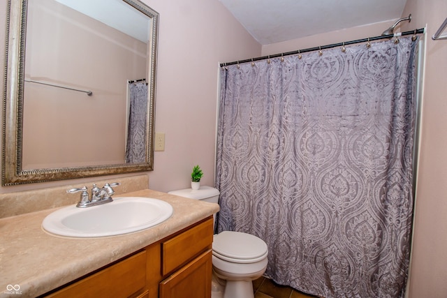 1404 Norton Dr, Greenwood, IN 46143 - full bath featuring toilet, vanity, and tile patterned flooring