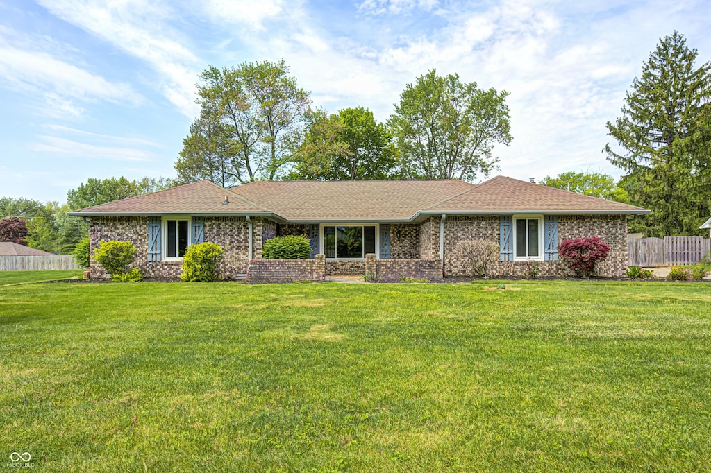 101 N Westbury Rd, Pendleton, IN 46064 - ranch-style house with a front yard, a shingled roof, and brick siding