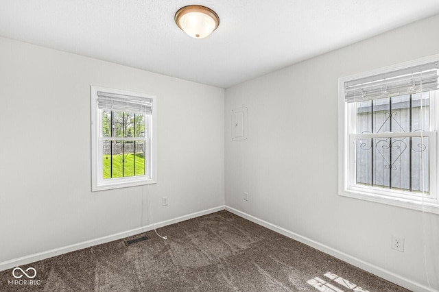 1391 N Shadeland Ave, Indianapolis, IN 46219 - empty room featuring dark carpet and baseboards