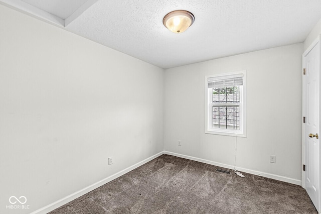 1391 N Shadeland Ave, Indianapolis, IN 46219 - carpeted empty room featuring baseboards and a textured ceiling