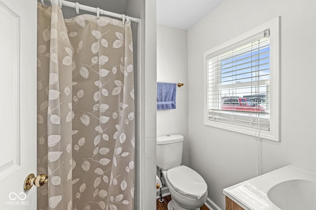 1391 N Shadeland Ave, Indianapolis, IN 46219 - bathroom featuring toilet, vanity, and curtained shower