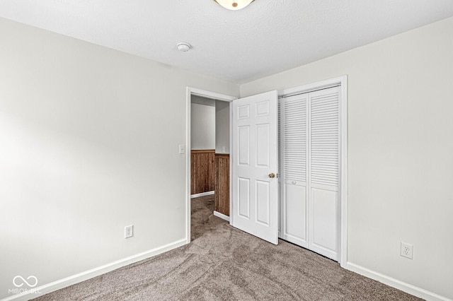 1391 N Shadeland Ave, Indianapolis, IN 46219 - unfurnished bedroom with carpet floors, a closet, and baseboards