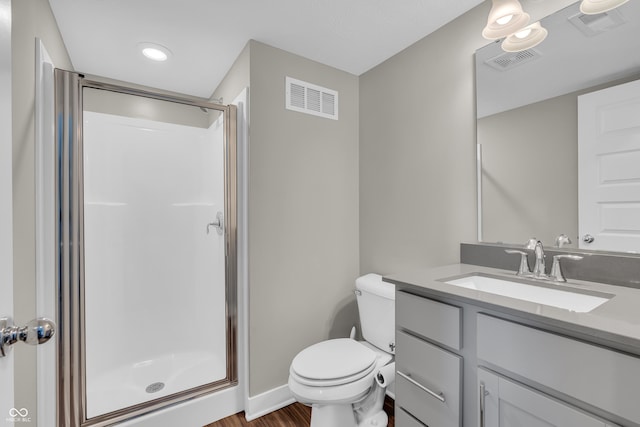 3546 Brampton Ln, Westfield, IN 46074 - bathroom with a stall shower, toilet, vanity, wood finished floors, and baseboards