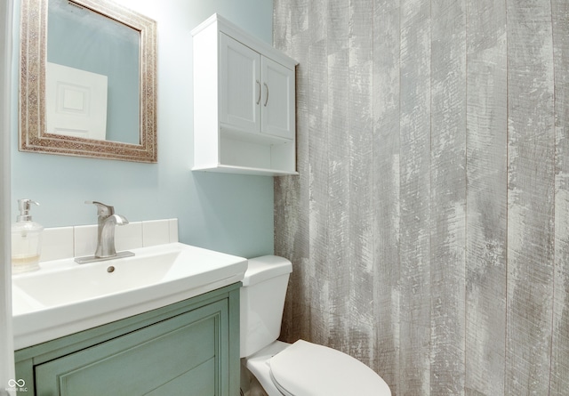 bathroom with toilet and vanity