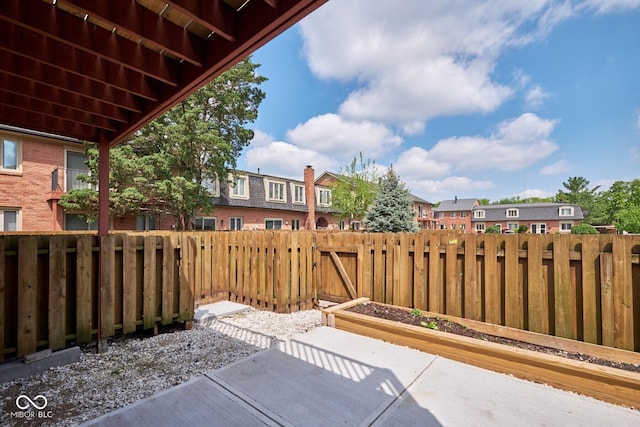 1142 Canterbury Sq S Unit B, Indianapolis, IN 46260 - view of patio with fence and a residential view