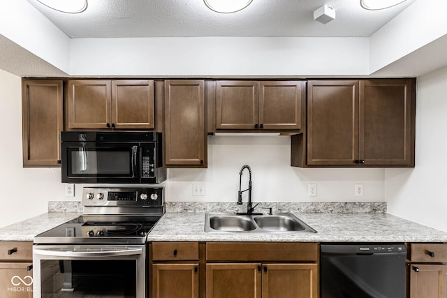 1142 Canterbury Sq S Unit B, Indianapolis, IN 46260 - kitchen featuring black appliances, a sink, light countertops, and dark brown cabinetry