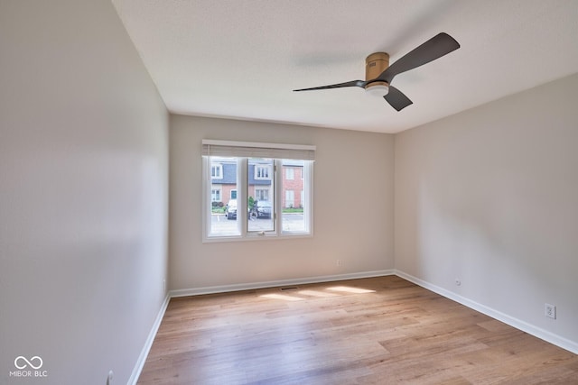 1142 Canterbury Sq S Unit B, Indianapolis, IN 46260 - empty room with light wood-style flooring, a ceiling fan, and baseboards