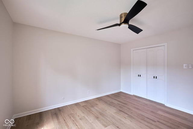 1142 Canterbury Sq S Unit B, Indianapolis, IN 46260 - unfurnished bedroom featuring wood finished floors, baseboards, and a closet