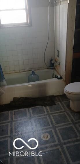 full bathroom with toilet and shower / bath combination