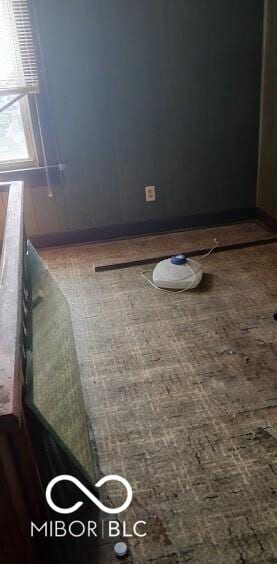 empty room featuring brick patterned floors