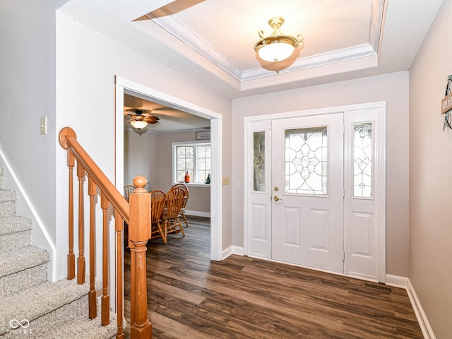 941 W Barouche, Pendleton, IN 46064 - entryway with dark wood-style flooring, a raised ceiling, stairs, baseboards, and crown molding