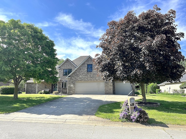 941 W Barouche, Pendleton, IN 46064 - traditional-style house with a front yard, driveway, stone siding, and a garage