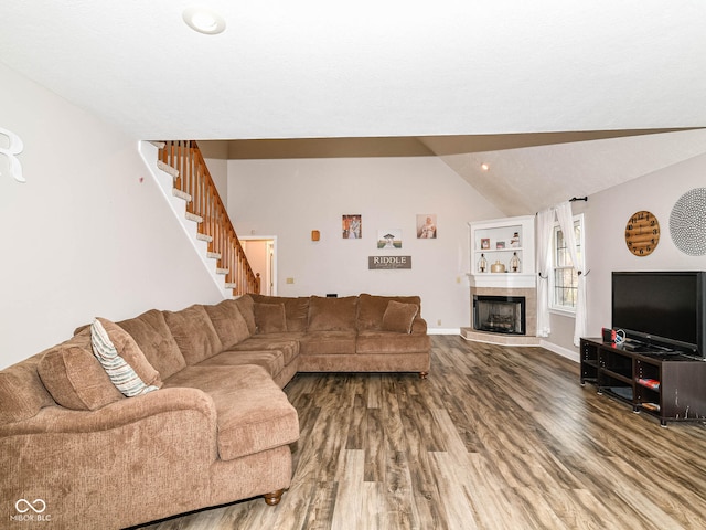941 W Barouche, Pendleton, IN 46064 - living area with lofted ceiling, wood finished floors, stairway, a fireplace, and baseboards