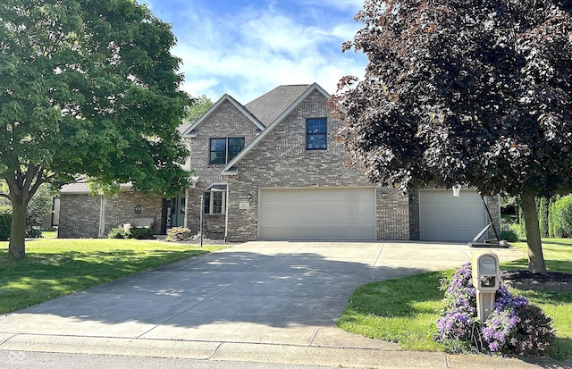 941 W Barouche, Pendleton, IN 46064 - traditional-style house with driveway, a front yard, brick siding, and an attached garage