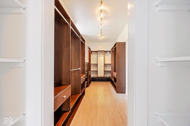 spacious closet with wood finished floors