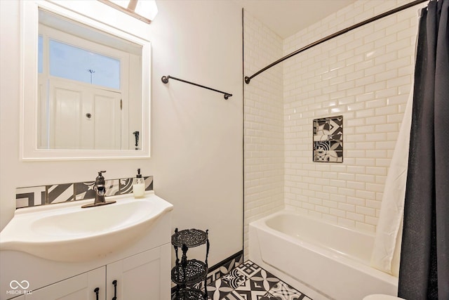 bathroom featuring shower / bathtub combination with curtain and vanity