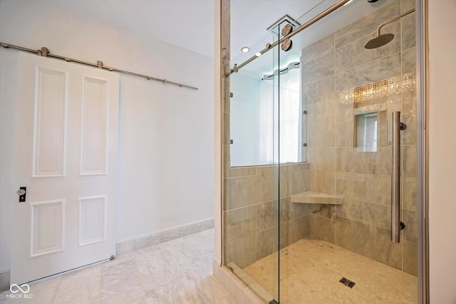 bathroom featuring a tile shower and baseboards