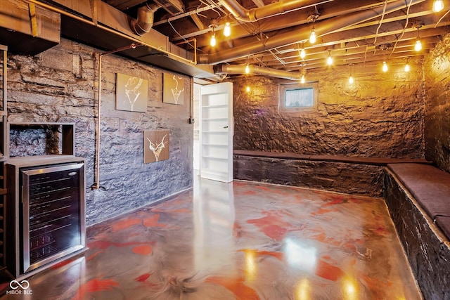 unfinished below grade area with beverage cooler