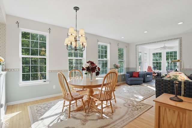 12065 Gray Eagle Dr, Fishers, IN 46037 - dining space with a chandelier, plenty of natural light, light wood finished floors, and recessed lighting