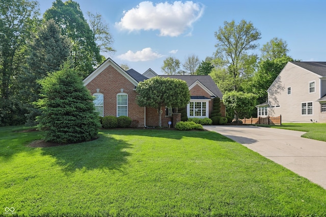 12065 Gray Eagle Dr, Fishers, IN 46037 - view of front facade featuring brick siding, a front lawn, and concrete driveway