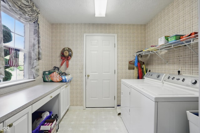 12065 Gray Eagle Dr, Fishers, IN 46037 - laundry room with washing machine and clothes dryer, light floors, and a textured ceiling