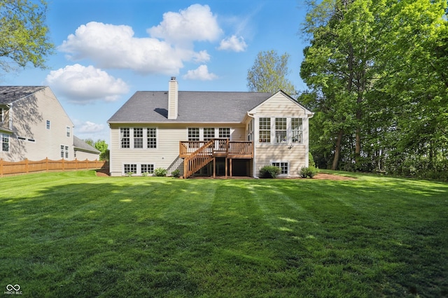 12065 Gray Eagle Dr, Fishers, IN 46037 - back of property featuring stairs, a chimney, a deck, and a sunroom