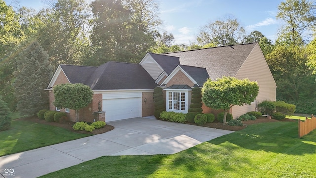 12065 Gray Eagle Dr, Fishers, IN 46037 - view of front of house featuring an attached garage, driveway, a front yard, and brick siding