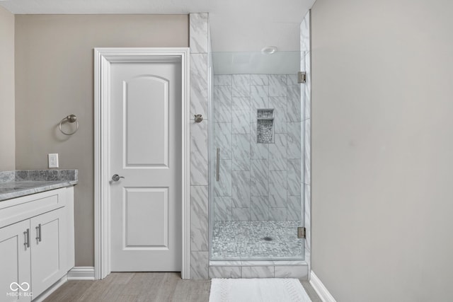 863 N Park Trail Dr, Carmel, IN 46032 - full bath with a shower stall, vanity, wood finished floors, and baseboards