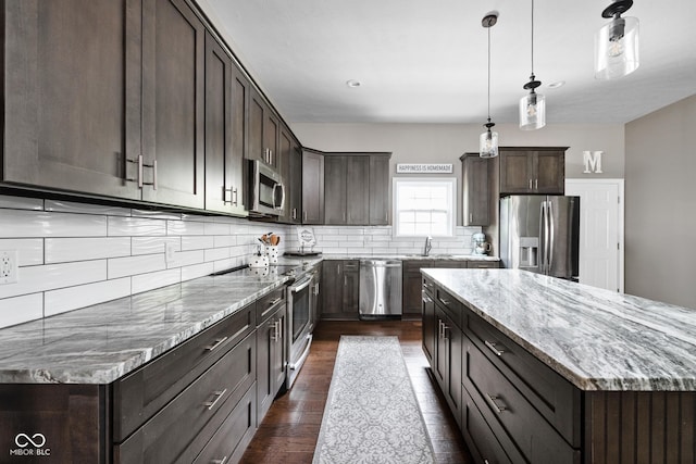 863 N Park Trail Dr, Carmel, IN 46032 - kitchen featuring appliances with stainless steel finishes, dark brown cabinetry, dark wood-style flooring, a sink, and backsplash