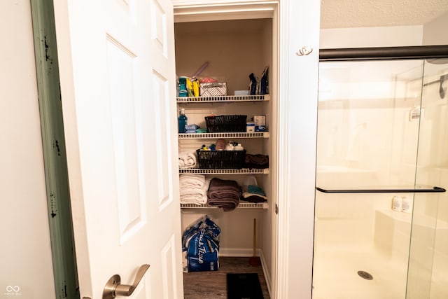 1334 Legacy Ct, Indianapolis, IN 46234 - full bath featuring a stall shower, wood finished floors, and baseboards