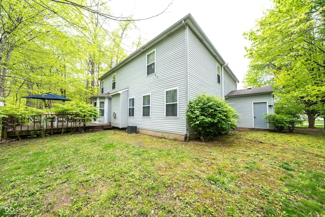 1334 Legacy Ct, Indianapolis, IN 46234 - back of property featuring a wooden deck and a lawn