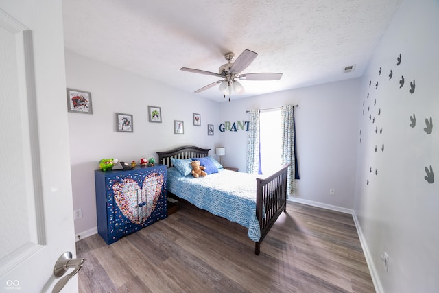 1334 Legacy Ct, Indianapolis, IN 46234 - bedroom with wood finished floors, baseboards, a textured ceiling, and ceiling fan
