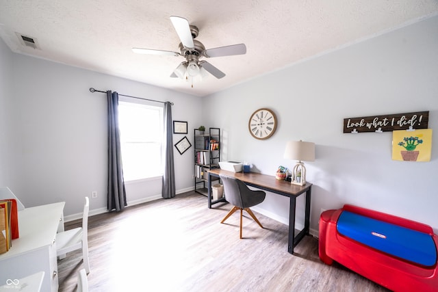 1334 Legacy Ct, Indianapolis, IN 46234 - office area featuring wood finished floors, a textured ceiling, a ceiling fan, and baseboards