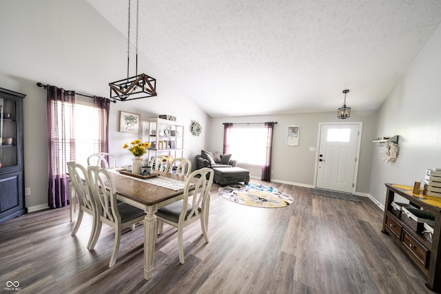 1334 Legacy Ct, Indianapolis, IN 46234 - dining room featuring a textured ceiling, dark wood-type flooring, vaulted ceiling, and baseboards