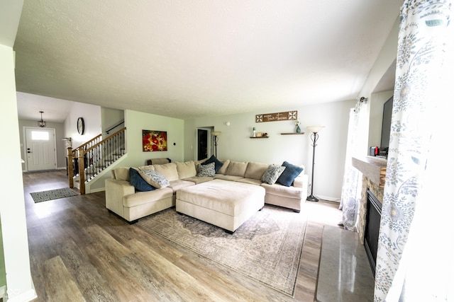 1334 Legacy Ct, Indianapolis, IN 46234 - living room featuring wood finished floors, stairs, a fireplace, and baseboards