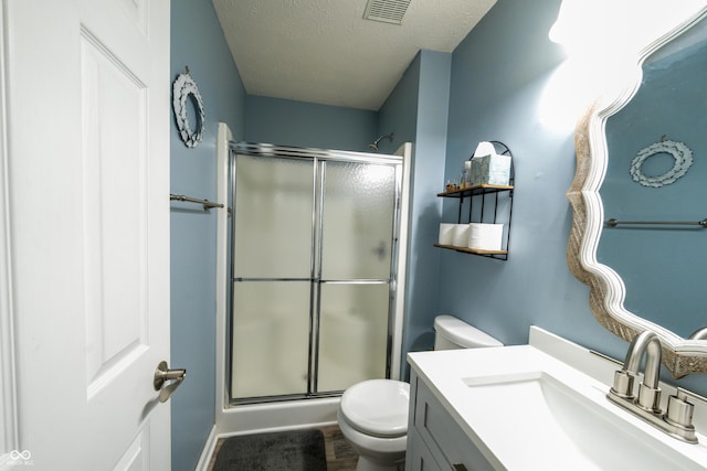 1334 Legacy Ct, Indianapolis, IN 46234 - bathroom with a shower stall, toilet, a textured ceiling, and vanity