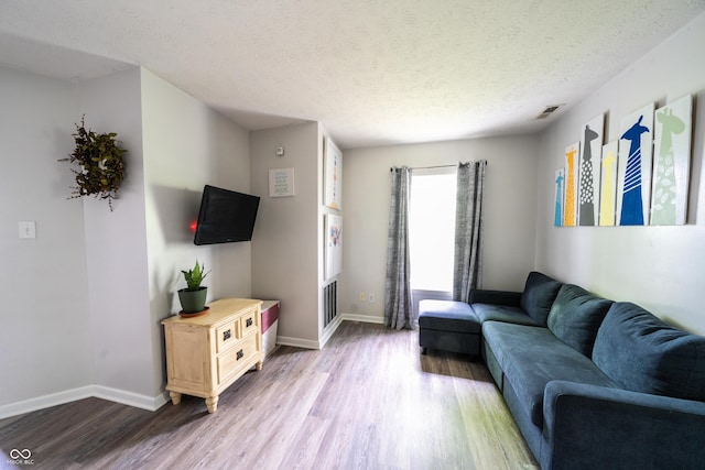 1334 Legacy Ct, Indianapolis, IN 46234 - living room with wood finished floors, baseboards, and a textured ceiling